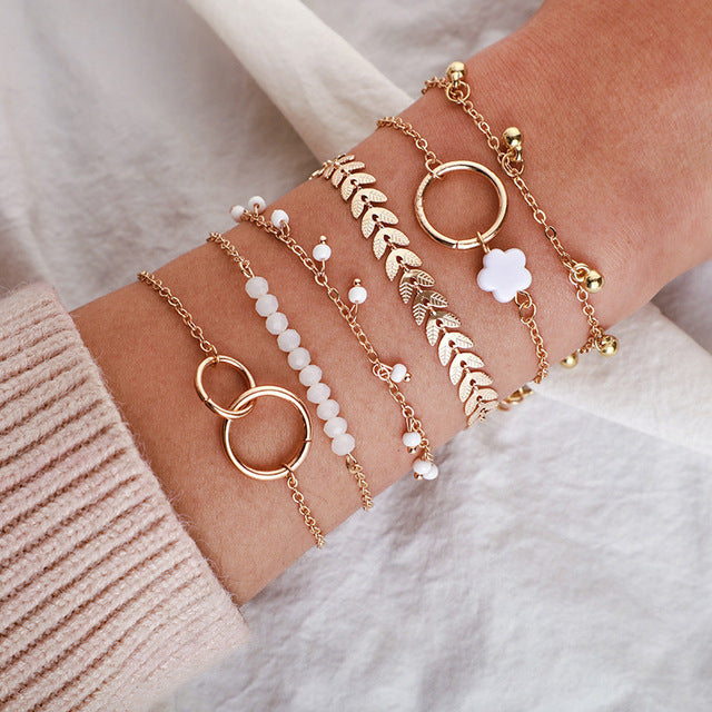 Lagdeling | Sæt med rosaguldfarvede armbånd – Visning 01