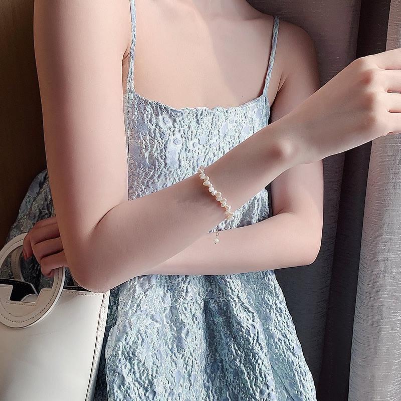 Céline | Armbånd med små uregelmæssige hvide detaljer – Visning 06