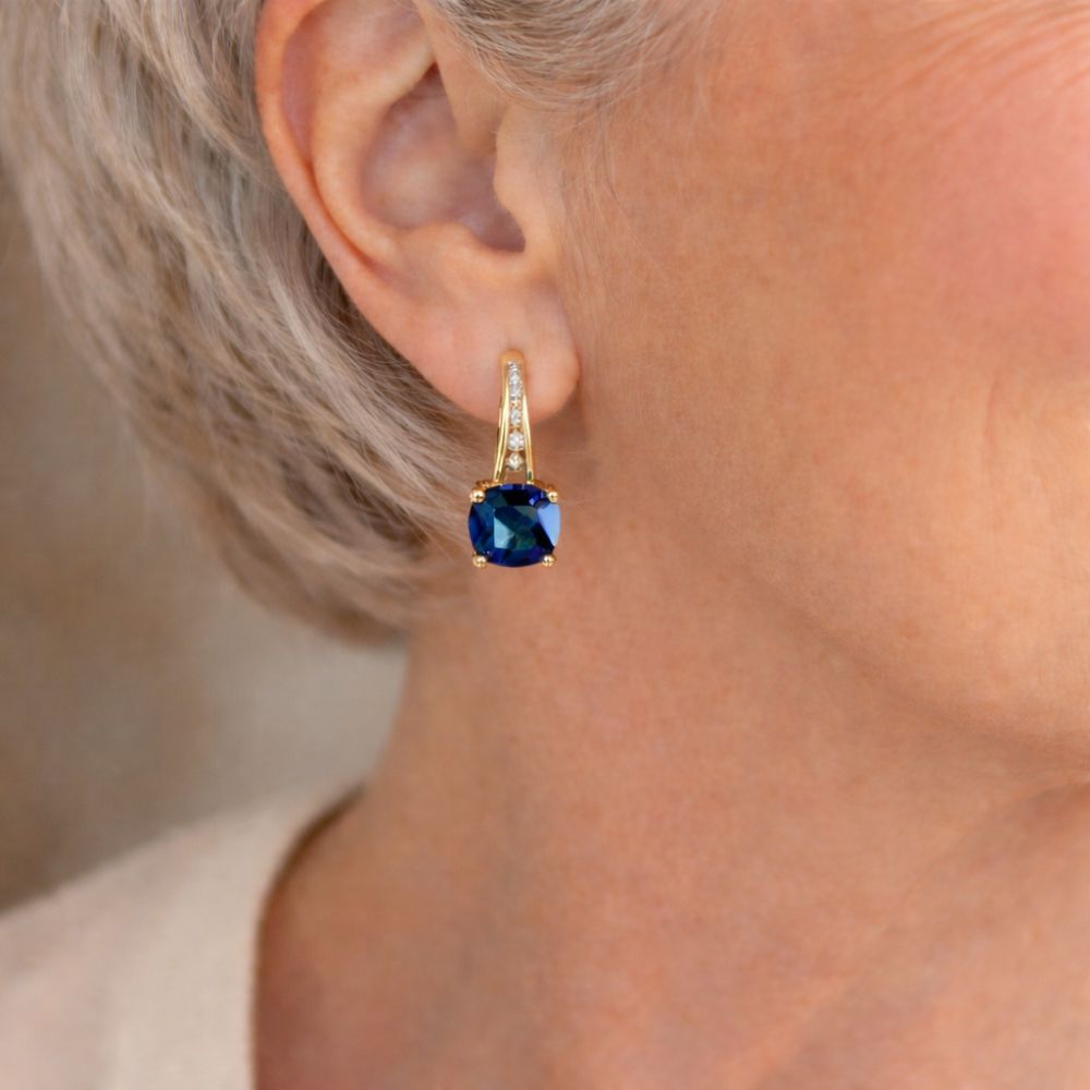 Blåblik | Guldfarvede øreringe med blå sten – Visning 02