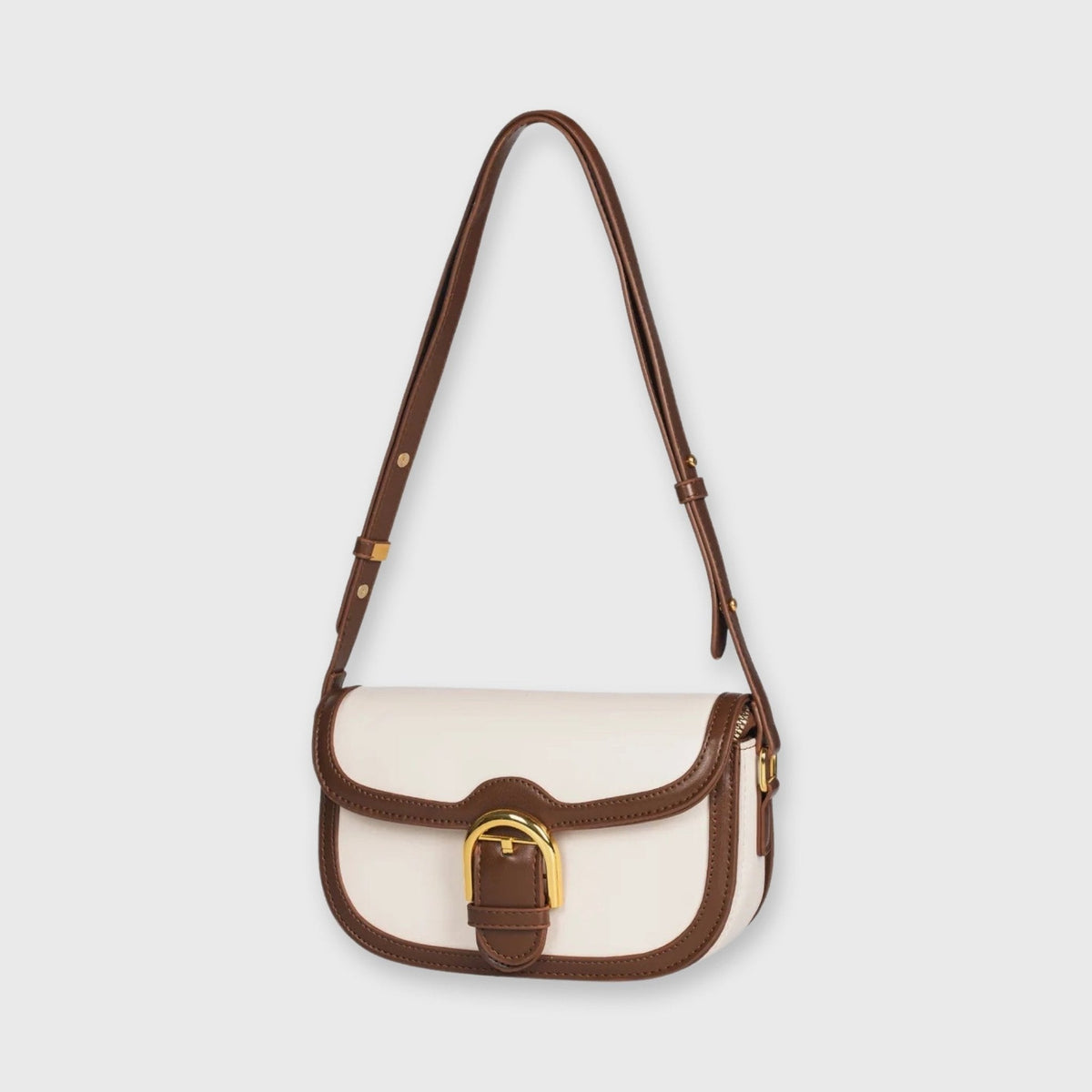 Creme/brun Bella mini skuldertaske set fra siden