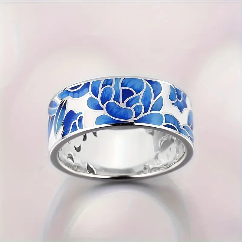 Blåblomst | Bred ring i sølvfarve med blåt blomstermotiv – Visning 01