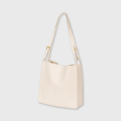 Creme Tote skuldertaske set fra siden